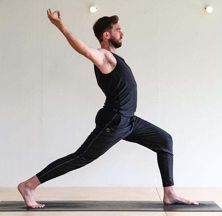 Man doing High lunge yoga (Utthita Ashwa Sanchalanasana)