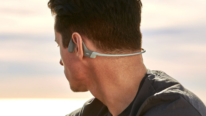Man wearing Shokz OpenRun bone conduction headphones